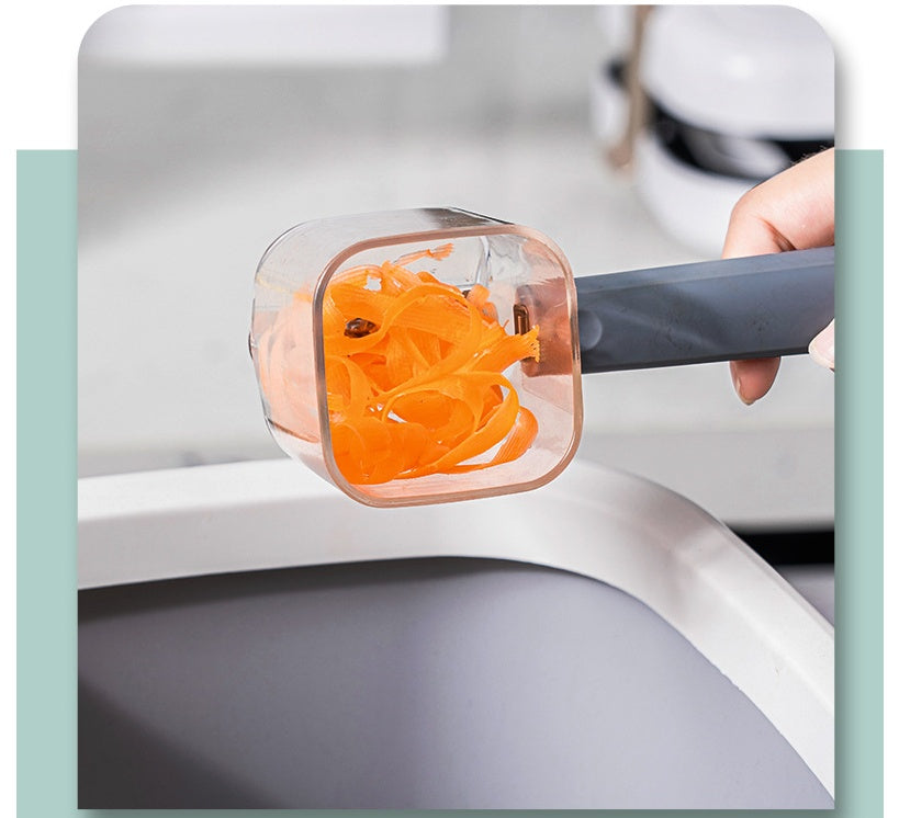 Spiralizer with orange carrot strands on a kitchen counter
